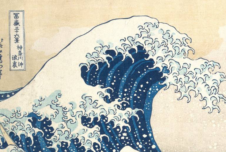 Detail of The Great Wave showing the clawed foam at the crest and the printed title cartouche in the top corner