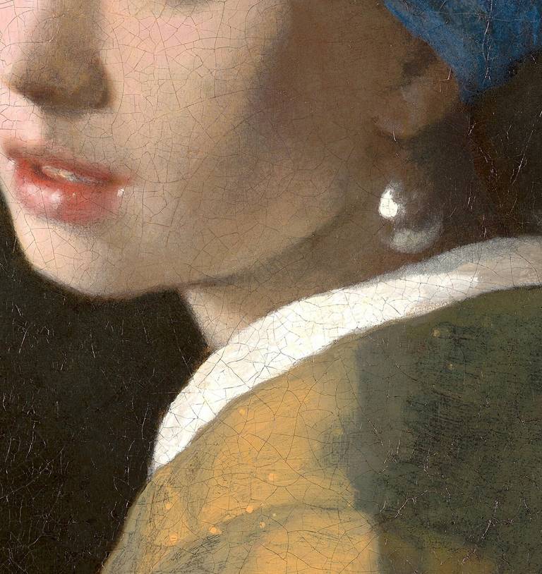 Detail of Girl with a Pearl Earring showing the pearl rendered in two strokes of white paint, with the lips below